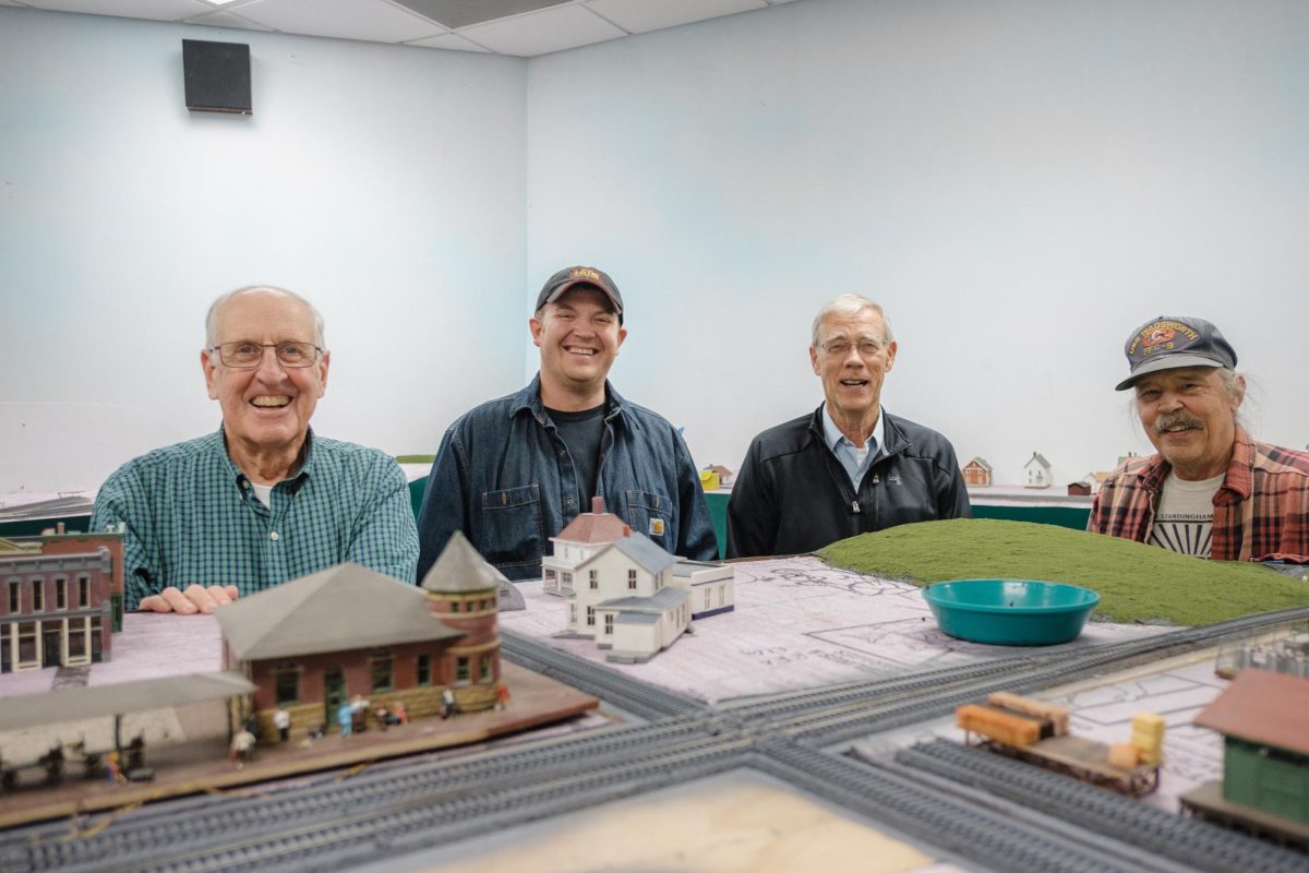 Grinnells Railway Express Model Club members Dave Benson, Jed Peterson, Michael Thorndike and Robin Broders showing off their developing historical Grinnell railway model. Not pictured is Chris Walters.