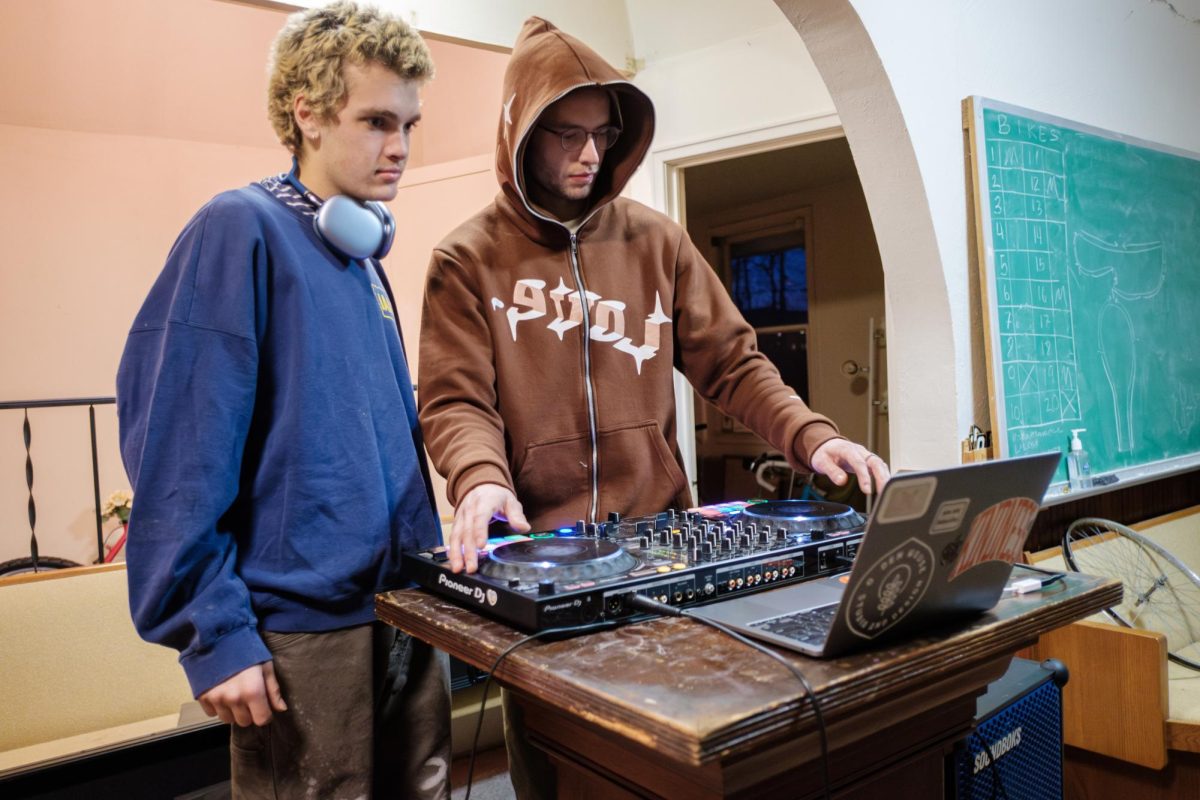 From left: Ethan Versh `27 and Eli Brotman `25 take turns DJing, showing each other aspects of their respective techniques. 