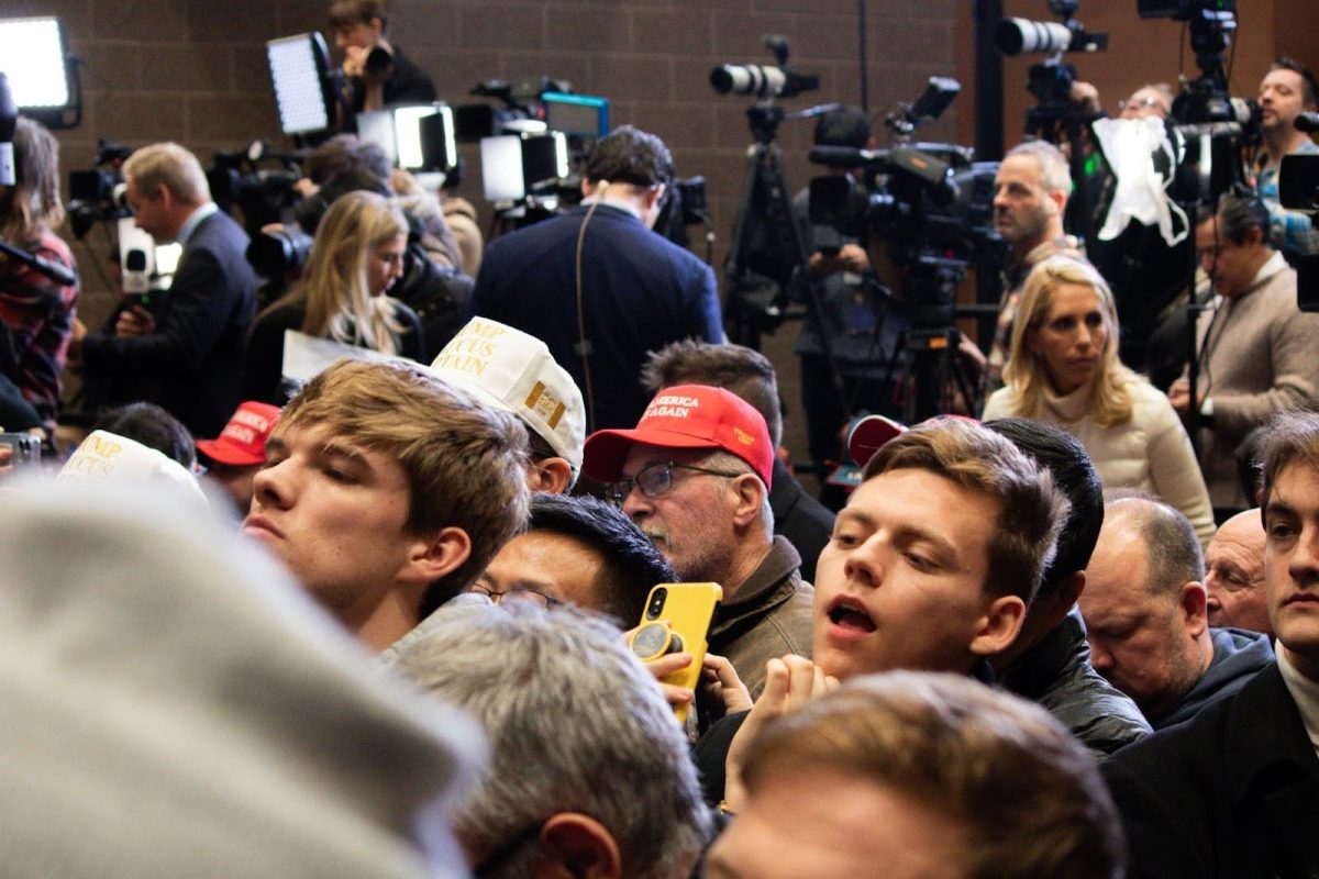 Attendees stand in front of the media section, waiting in anticipation for Trump to take the stage. Trump addressed the reporters in the back of the room numerous times during his speech, referring to the media as “fake news.”