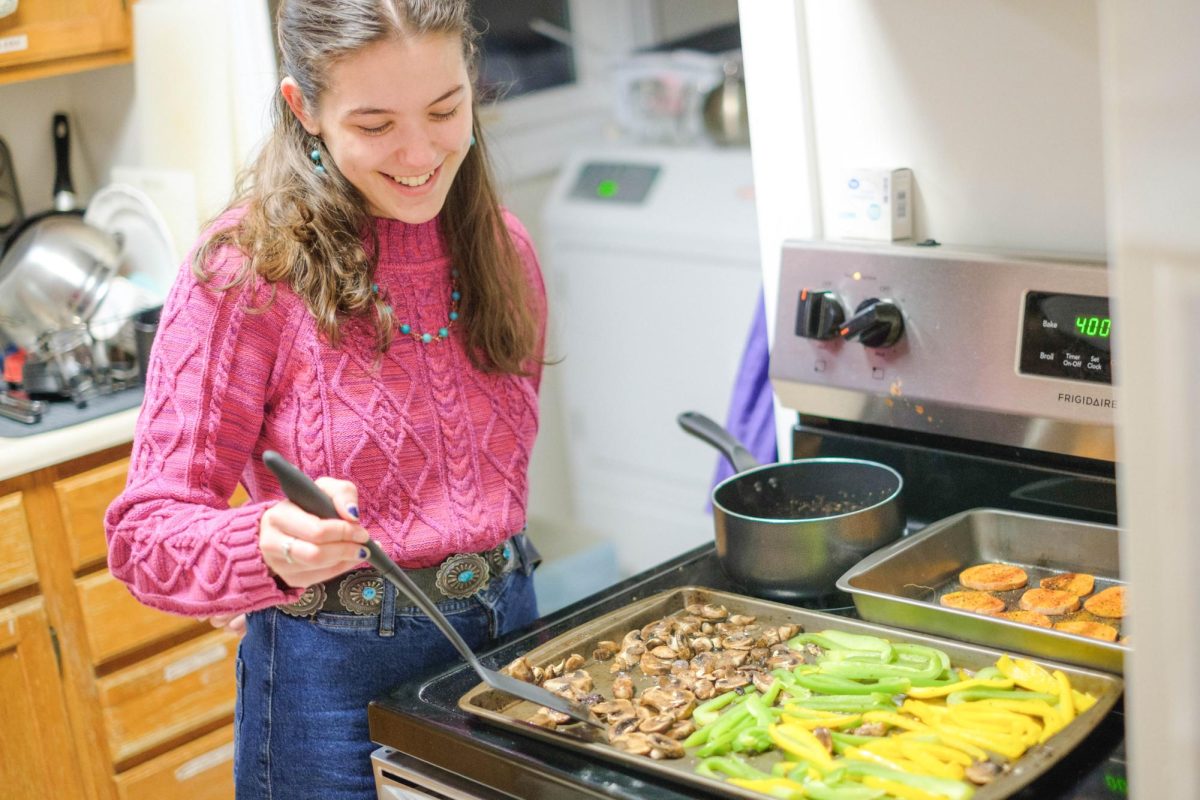 Bella Villareal `26 cooks at Grinnellians Who Are Ready to Cook (GWARC) house, where she has found community.