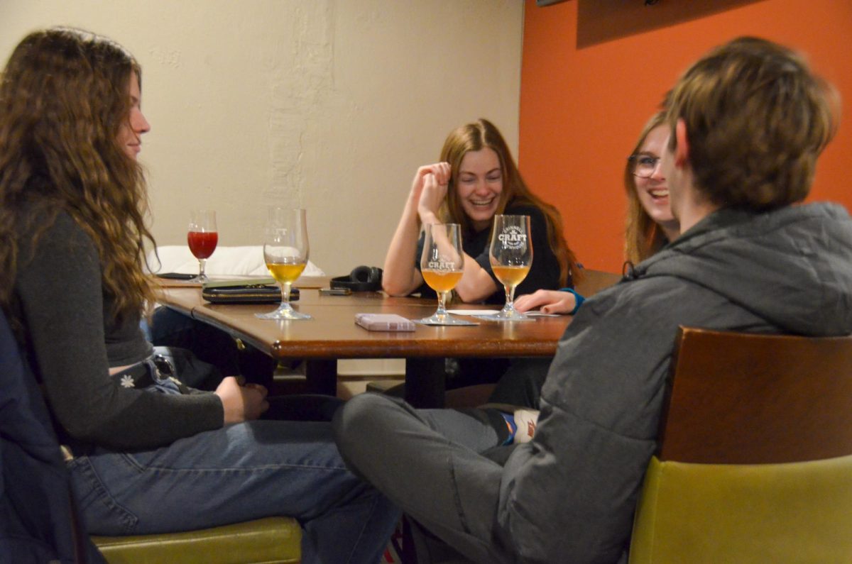 From left: S&B co-editor-in-chief Eleanor Corbin `24, friend of The S&B Sadie Weiner `24, S&B writer Allison Moore `24 and S&B copy editor Sam Bates `24 enjoy some drinks at the Grinnell Craft Brewhouse. 