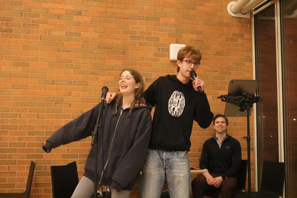 DJ Joe Culver of Dining Services was happy to see many students take this event as an opportunity to sing with their friends — in this case, “TiK ToK” by Kesha, sung by Maizie Schaffner `26 and Felix Benardo `25. (Brisa Zielina)
