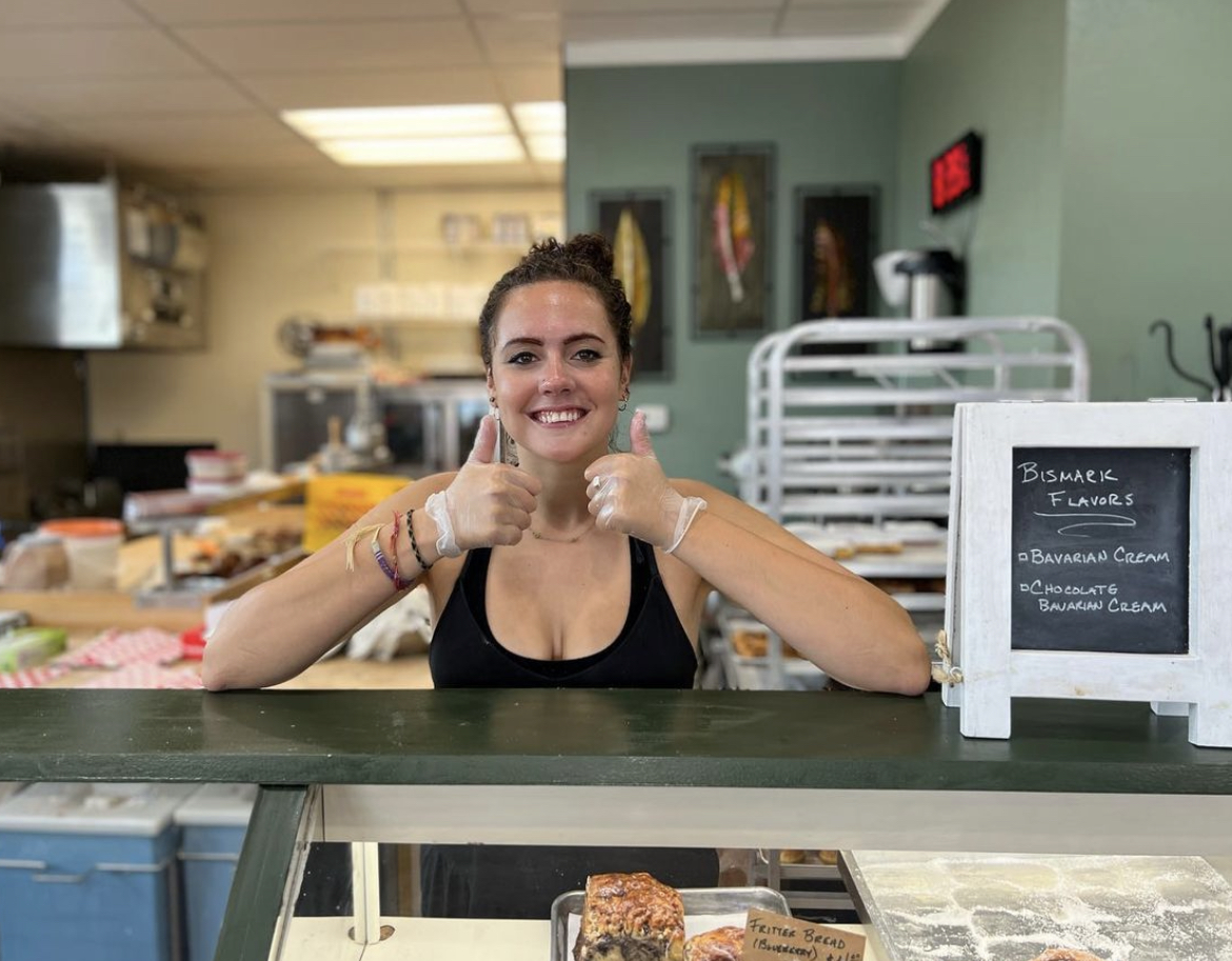 Meredith Benjamin `24 working a shift at Grin City Bakery.