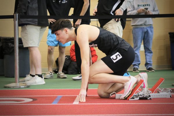 Lucas Fadden `26 prepares to take off ahead of the 200-meter dash.