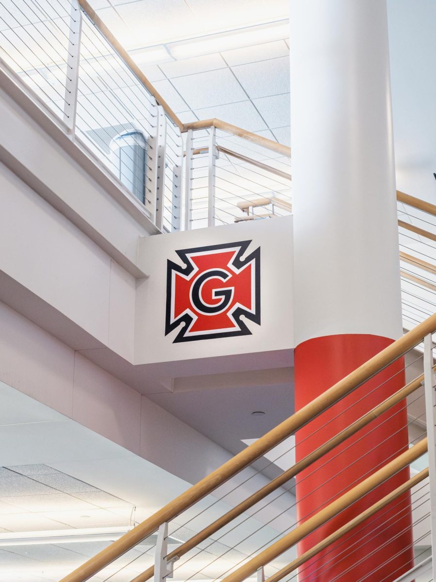 The Honor G logo on the wall of the Charles Benson Bear 39 Recreation and Athletic Center weight room. The logo will no longer be printed on new athletic gear according to multiple coaches and athletes.