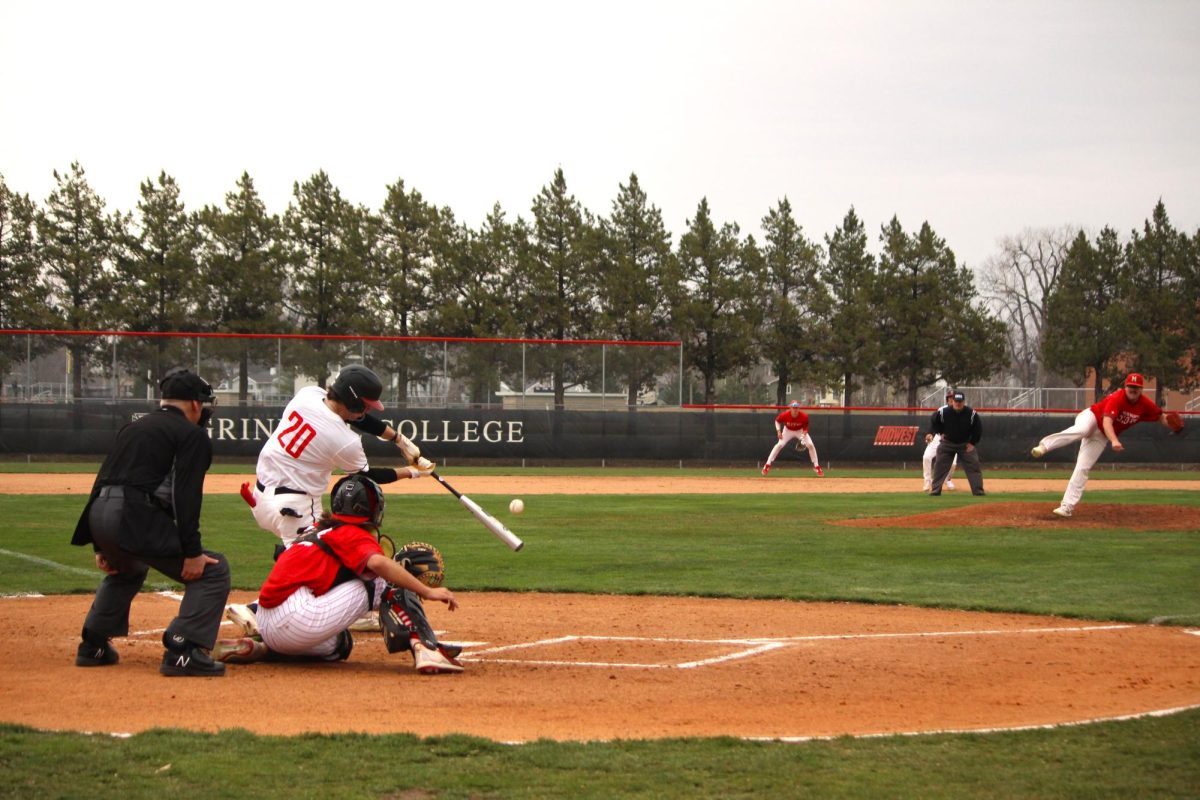Nathan McCurdy 25 hits the ball while at bat against Monmouth College on March 29. Grinnell won the game 13-6 and the three-game series against Monmouth College 2-1.