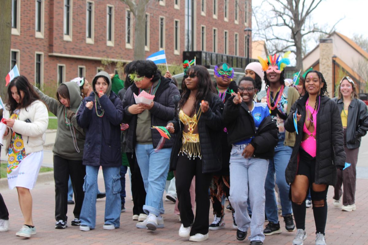 Students paraded down 8th avenue with flags, masks and decorated cars to celebrate a cultural tradition for the African and Latine diaspora.
