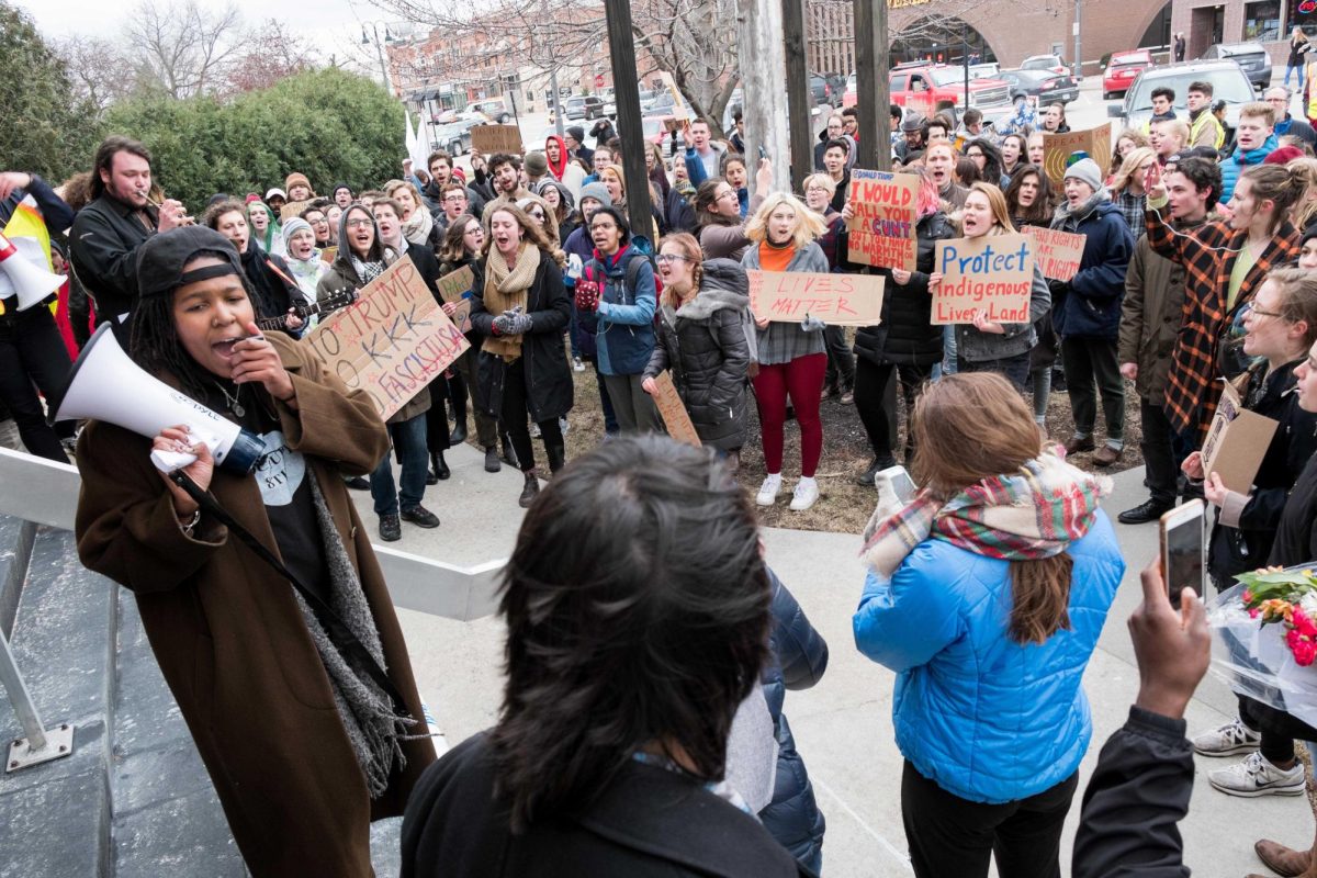Students protest outside of Wells Fargo in 2017. Among Grinnell students, 77% said they worry 