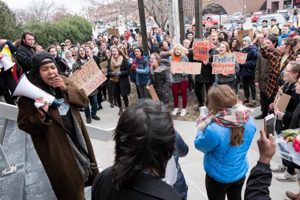 Students protest outside of Wells Fargo in 2017. Among Grinnell students, 77% said they worry a little or a lot about damaging their reputation because someone misunderstood them. 