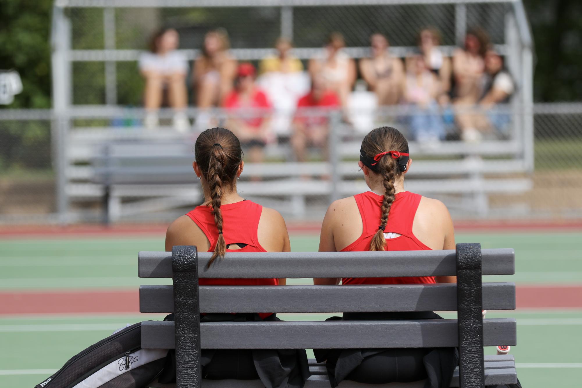 Nehir Ergun (left) and Kalea Martin (right) take a break after winning their first set during a conference match against Illinois College at Grinnell on Saturday, Sept. 14, 2024.