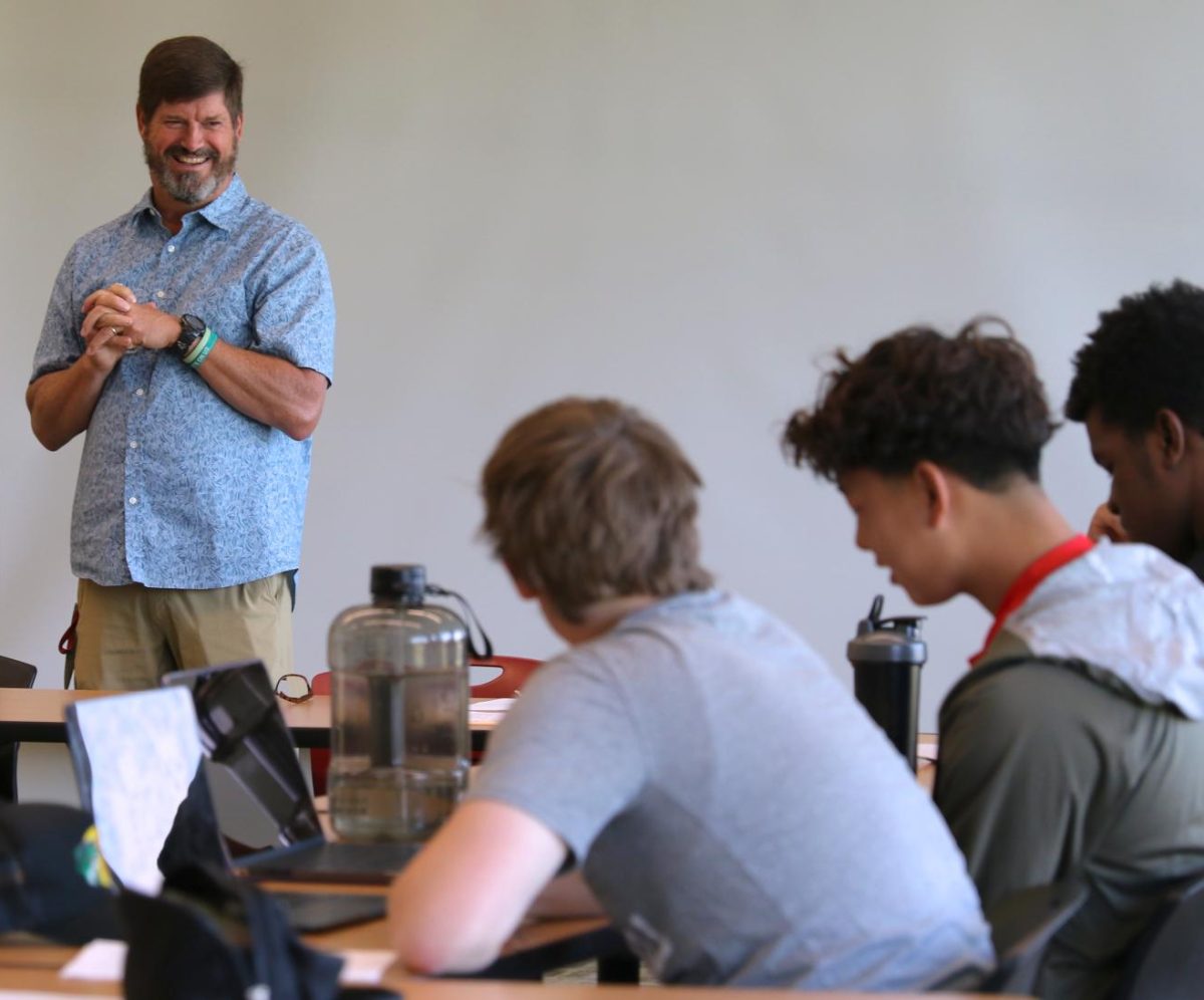 Professor Andy Hamilton welcomes his students to "The Black Athlete: Changing 20th and 21st Century Society" first-year tutorial course in a Bear Athletic Center classroom on Tuesday, Sept. 10, 2024.