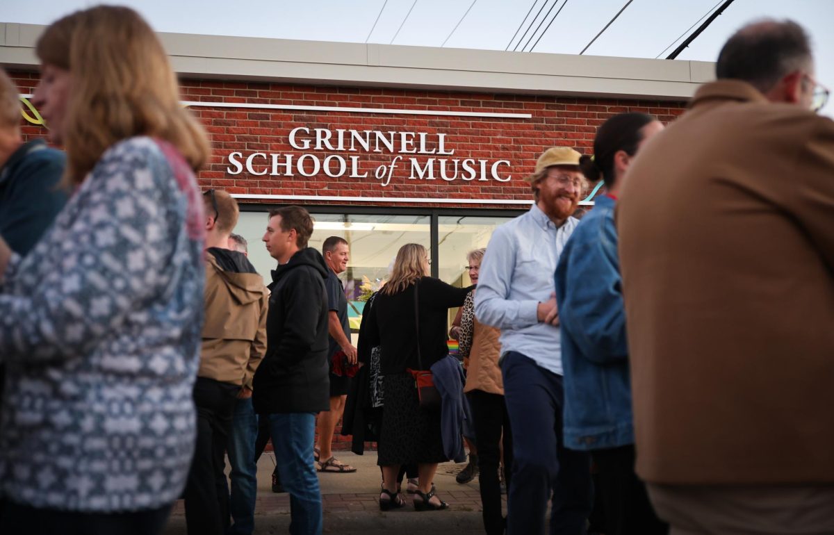 Community members mingle at the opening celebration for the Grinnell School of Music in downtown Grinnell on Friday, Sept. 7, 2024.