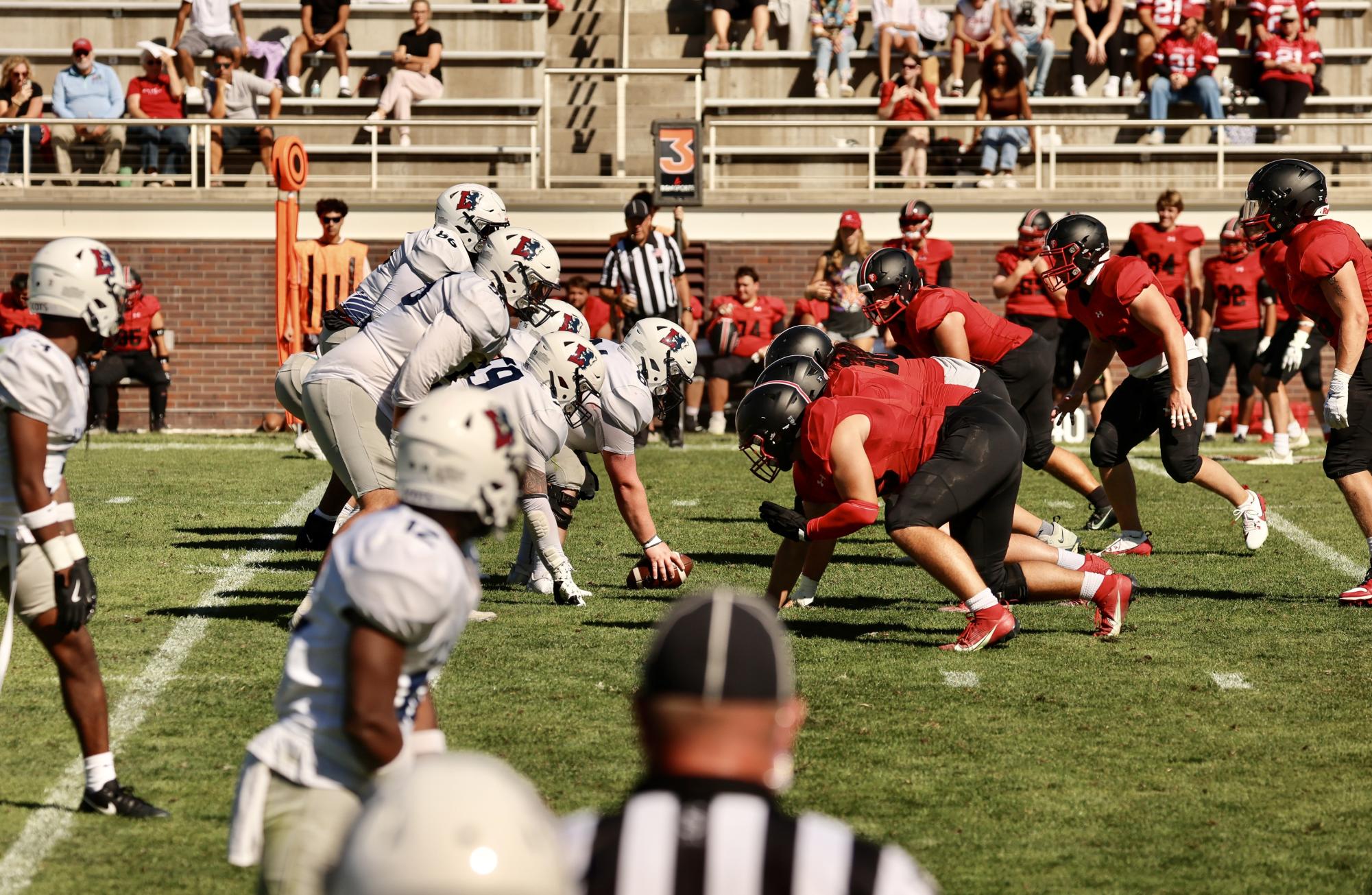 The Grinnell football defense prepares for the snap during a game against Lyon College at Rosenbloom Field on Saturday, Sept. 7, 2024.