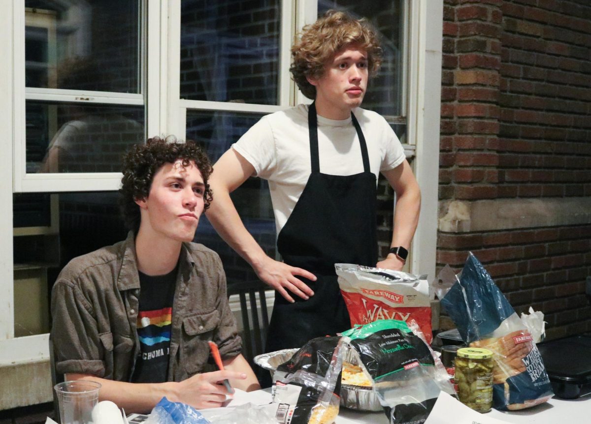 Jack Broadmoore `27 and AJ Trimble `27 take orders at their grilled cheese business in the South Campus loggia on Friday, Sept. 6, 2024.