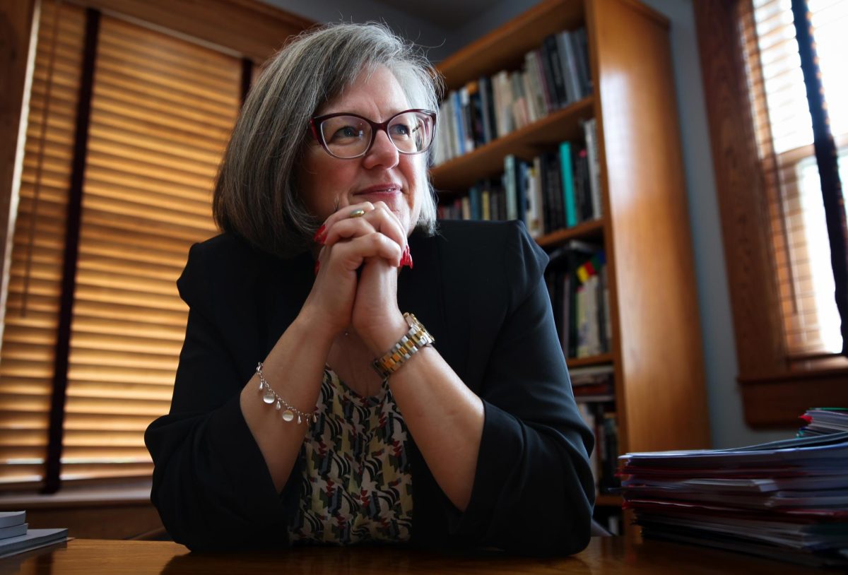 Grinnell College President Anne Harris poses for a portrait at her desk in Nollen House on Monday, Sept. 9, 2024.