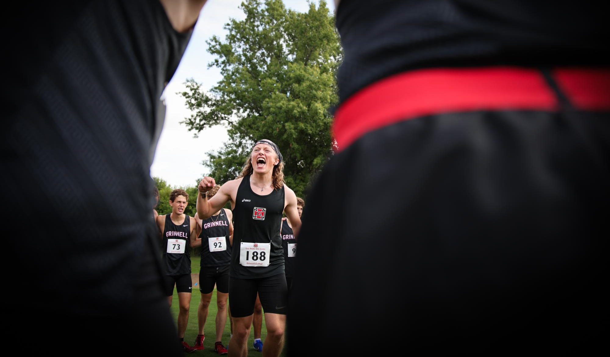 Andrew Nickeson `23.5, currently serving as an assistant coach, hypes up the men’s cross country team.