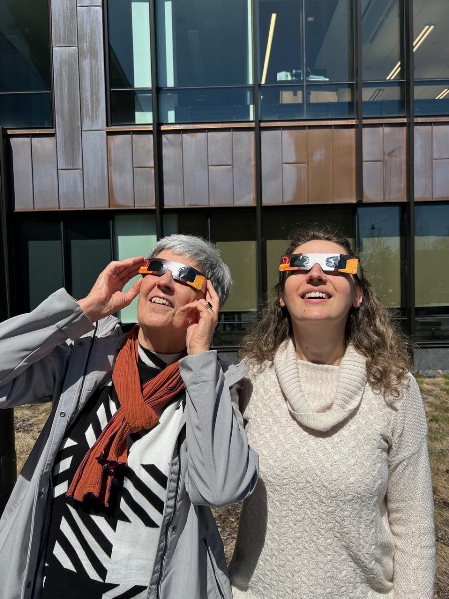 German studies department Writer in Residence Susanne Hornfeck and assistant professor Viktoria Poetzl catch the total solar eclipse on April 8, 2024.