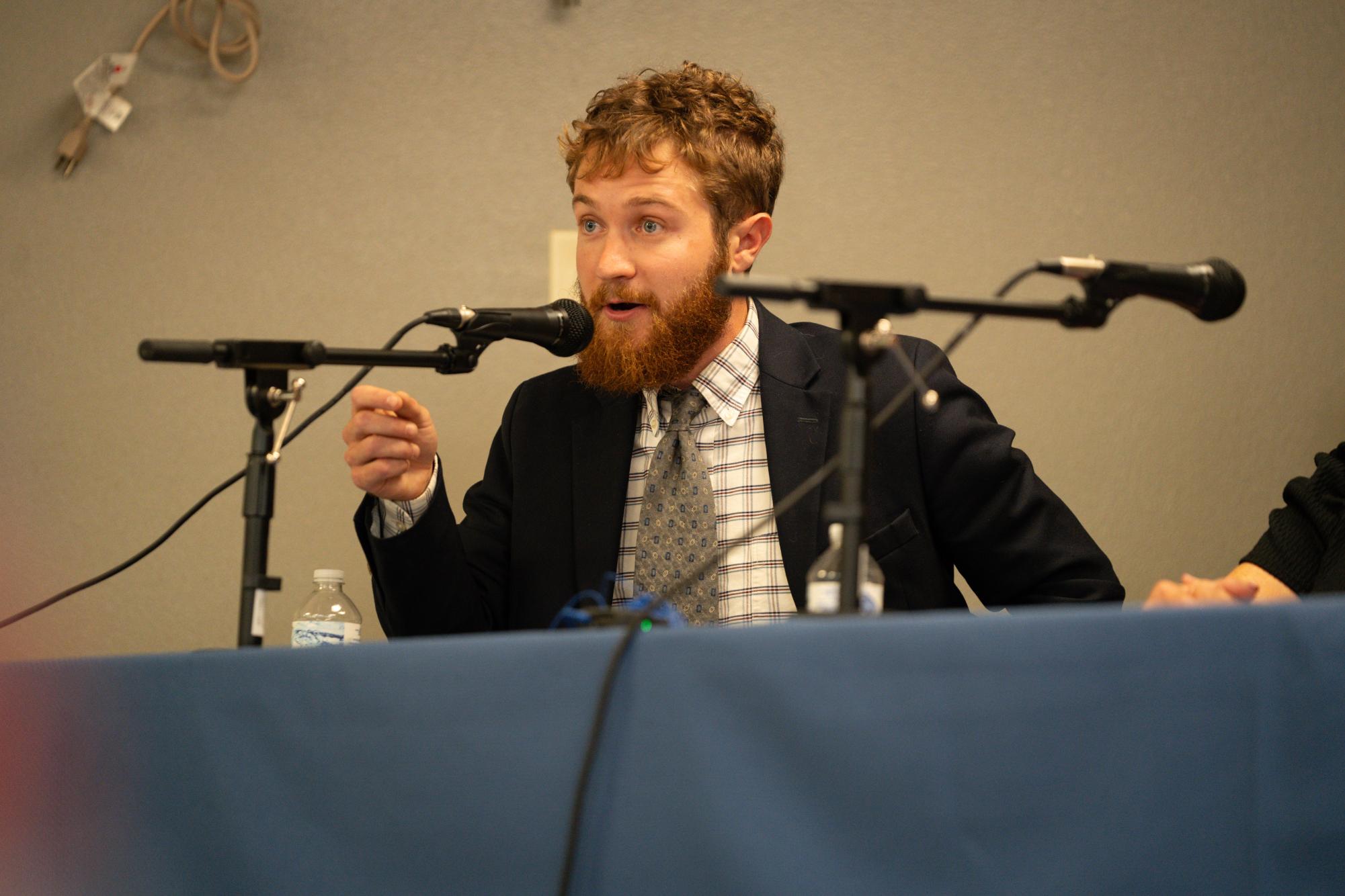 Tommy Hexter `21, Iowa House District 53 candidate, gestures towards the crowd on Tues. Oct. 1, 2024. 