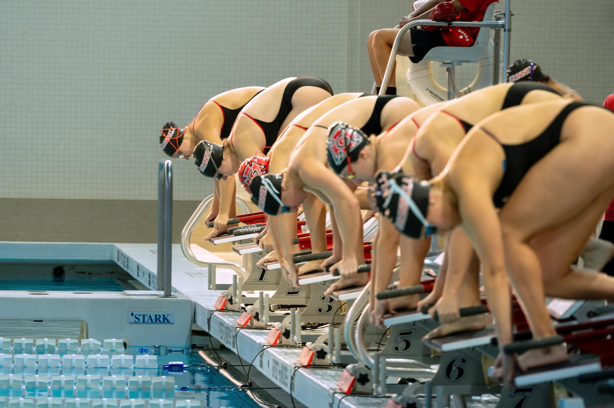 The team prepares to dive into the pool. 