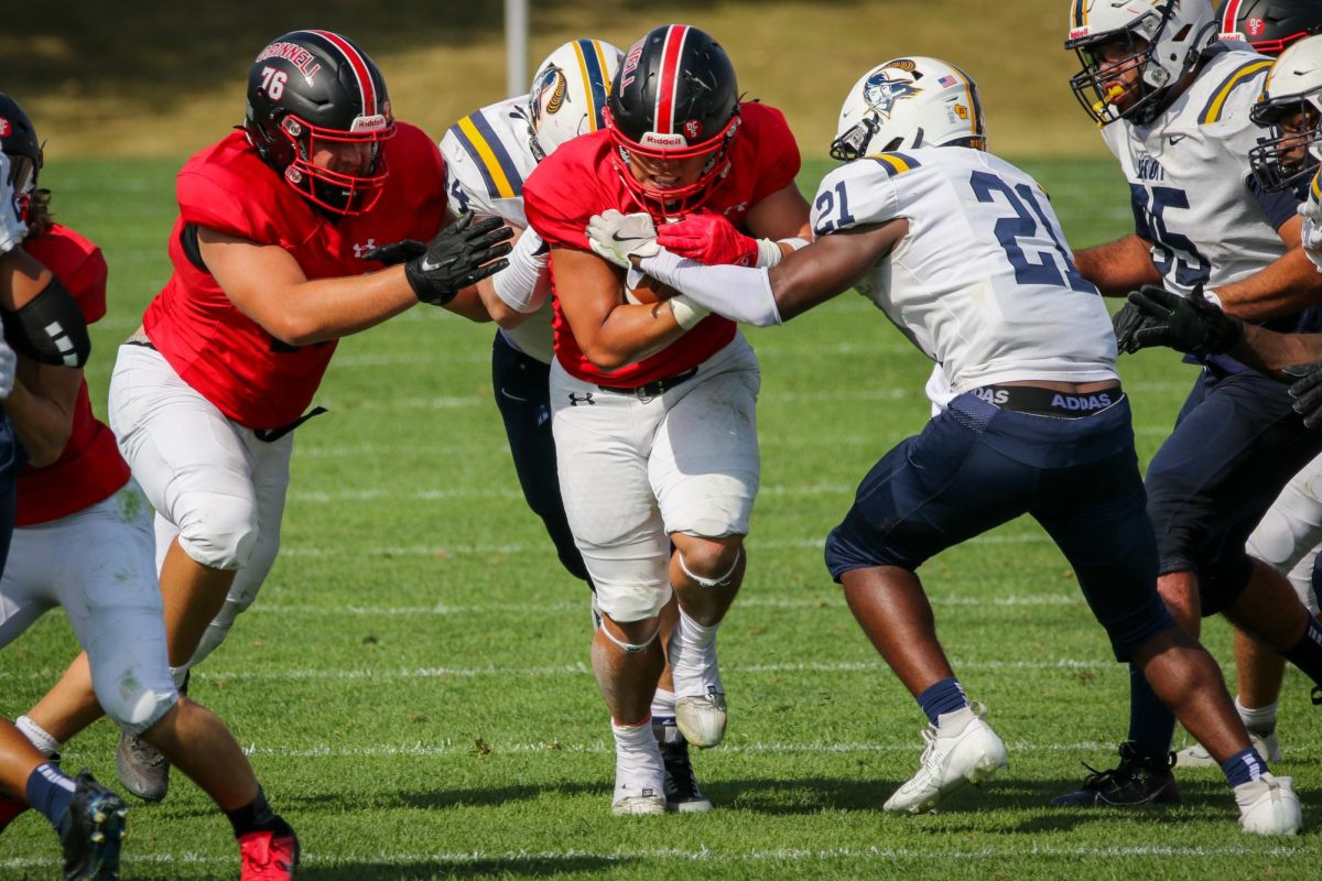 Marcus Sung (center) fights through defense during a game at Rosenbloom Field on Saturday, Sept. 21, 2024.