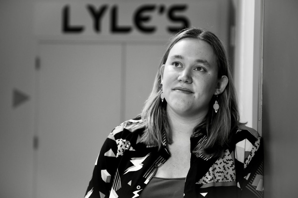 Clara Bode `26 poses for a portrait in front of Lyle's Pub in the basement of the Joe Rosenfield `25 Center on Oct. 30, 2024.