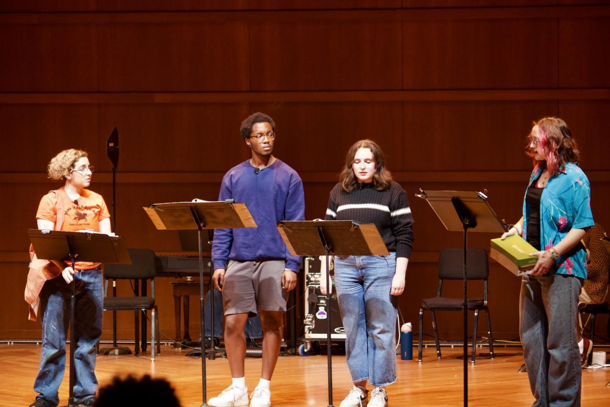 The cast performs on stage at Sebring Lewis Hall.