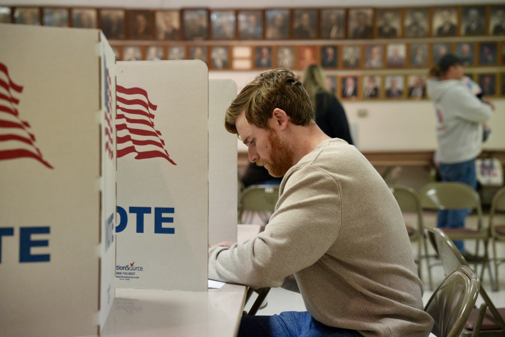 Ryan Hollibaugh, 26, fills out his ballot inside a polling booth at Elks Lodge, Grinnell, Iowa on Tues. Nov. 5.