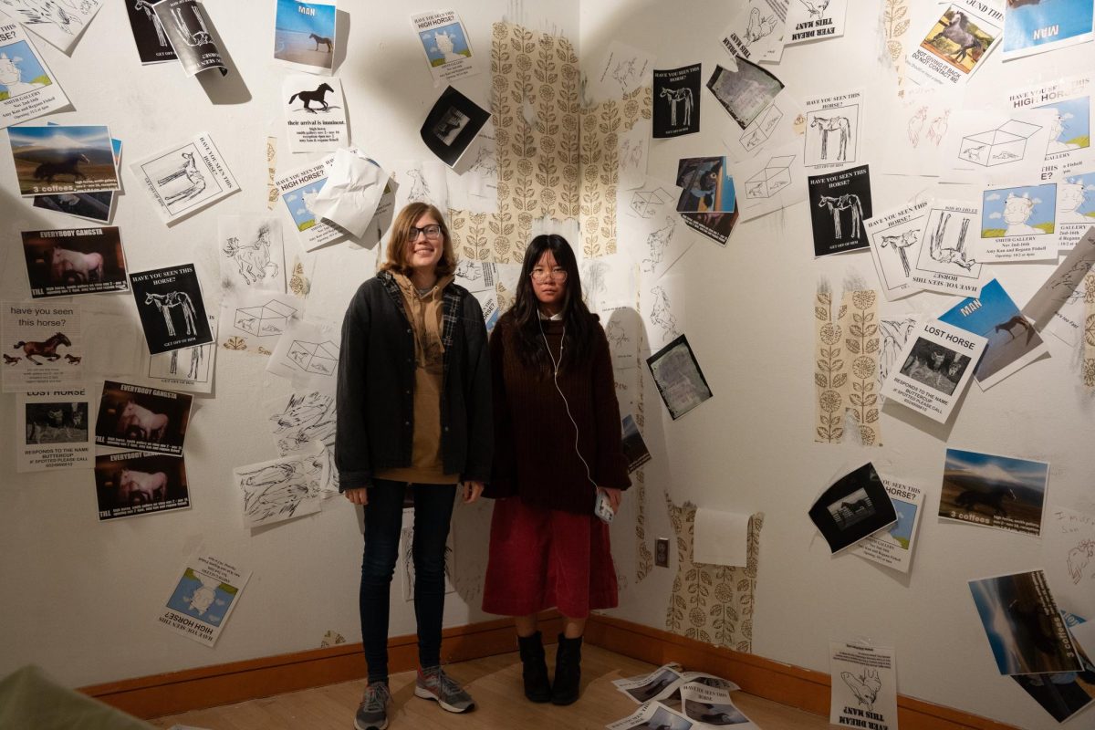 Regann Fishell (left) & Amy Kan stands in front of their Smith art gallery exhibit "High Horse". 