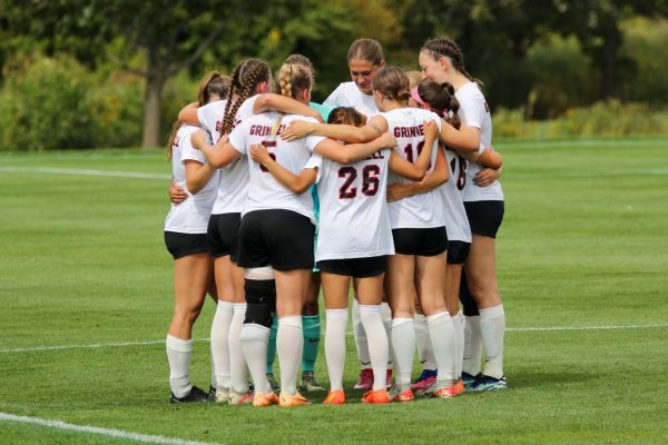 The team huddles during a game against Lake Forest at Springer Field on Saturday, Sept. 28, 2024.