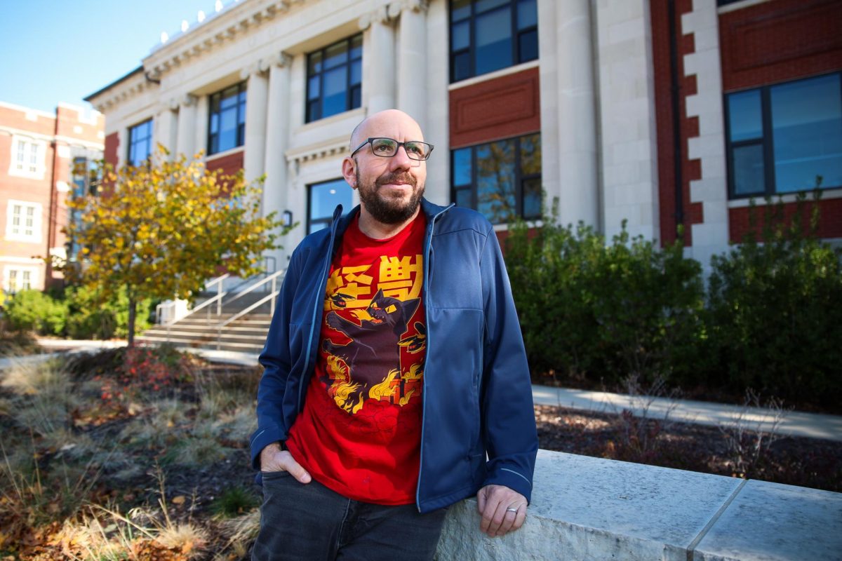 Alexi Zentner poses for a portrait outside of Carnegie Hall in Grinnell, Iowa on Nov. 1, 2024.