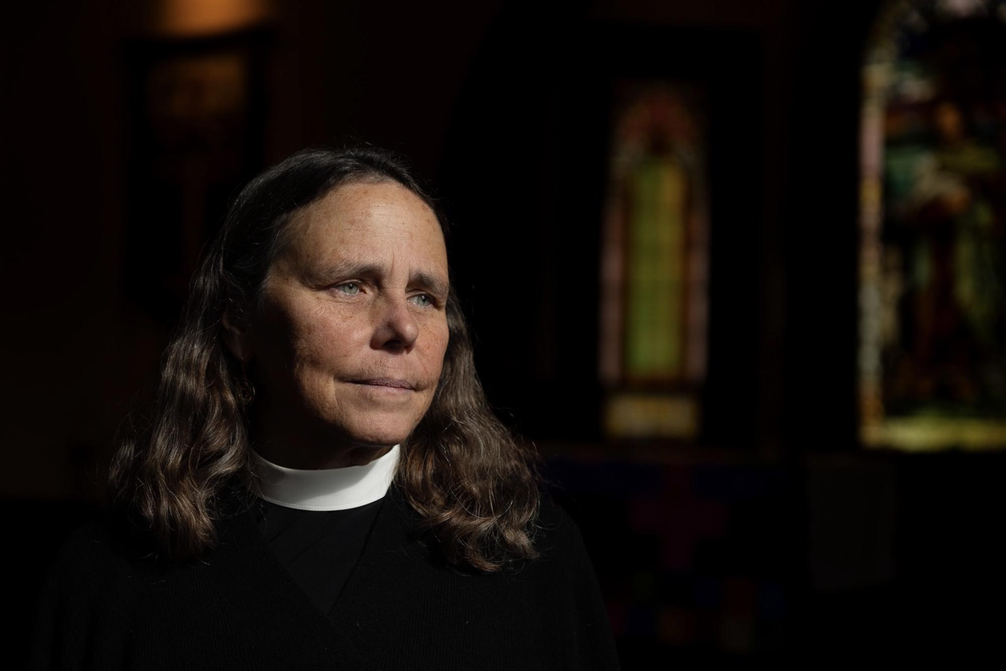 Rev. Wendy Abrahamson poses for a portrait after leading a short prayer service aimed at reducing election anxiety at St Paul's Episcopal Church in Grinnell, Iowa on Nov. 5, 2024.