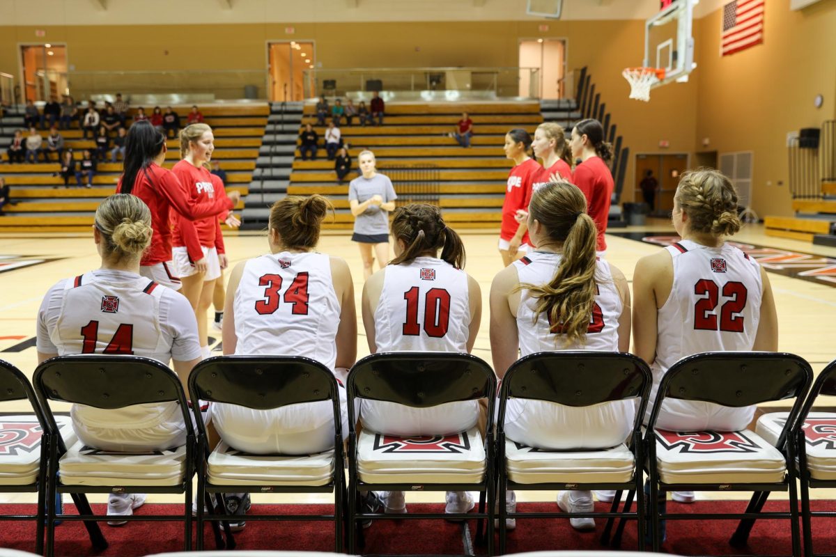 The starting lineup prepares for tipoff in the season opener against Central Christian (KS) on Friday, Nov. 8, 2024.