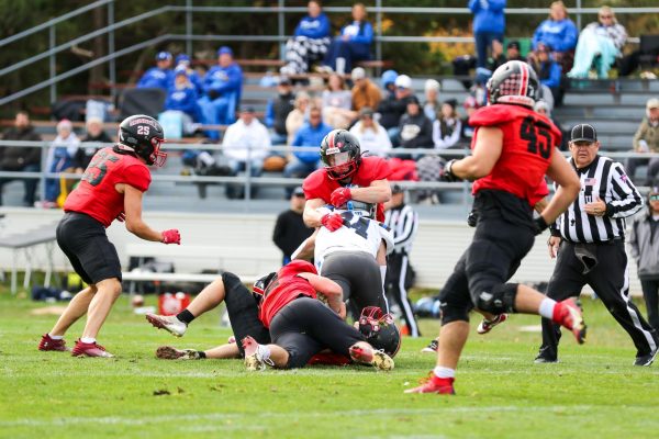 Grinnell defense stop an Illinois College receiver during the senior day game against Illinois College on Saturday, Nov. 2, 2024.