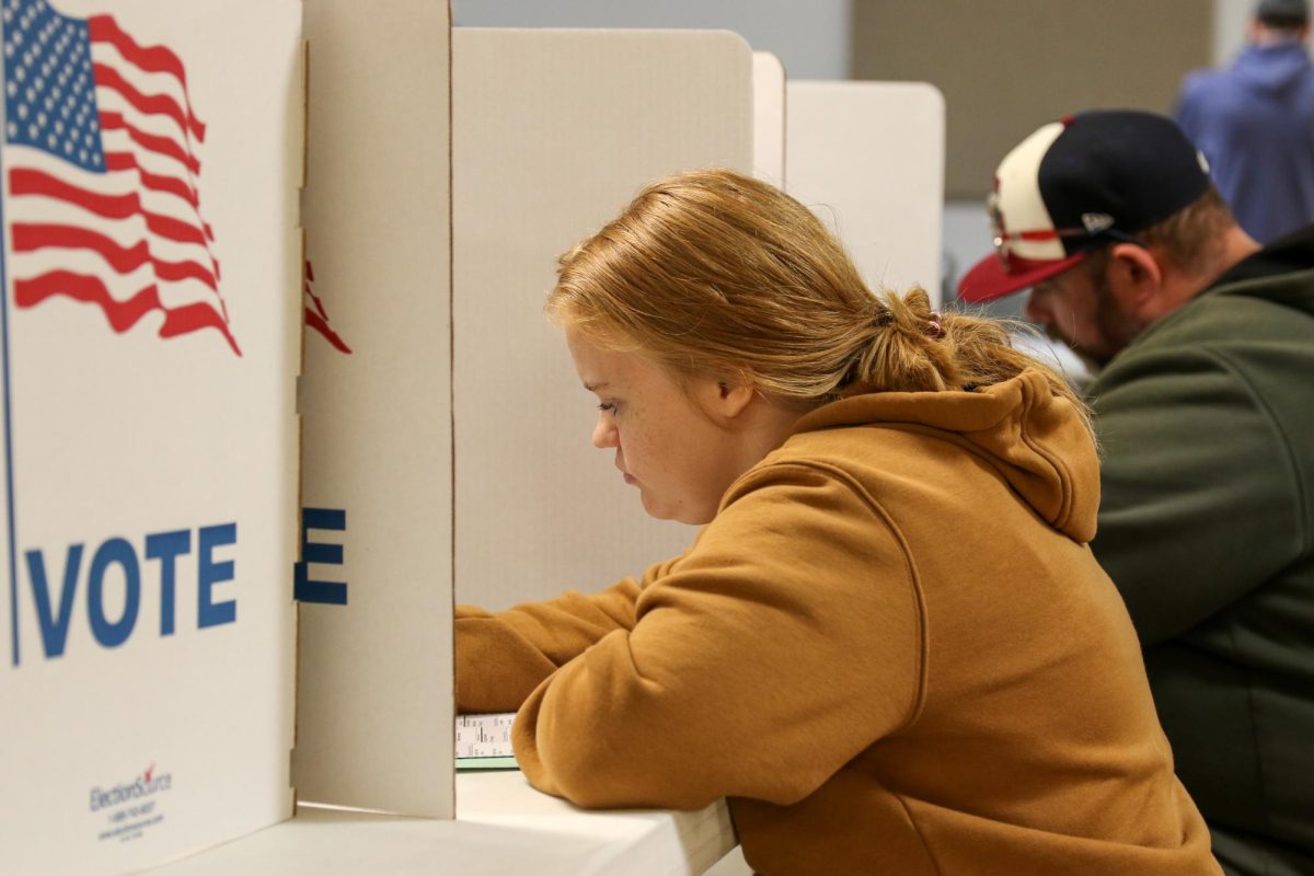 Makaela Lloyd (19), Indepdenent Party, votes in Grinnell 4th Ward at the Poweshiek County Fair 4-H
Building in Grinnell, Iowa on Nov. 5, 2024.