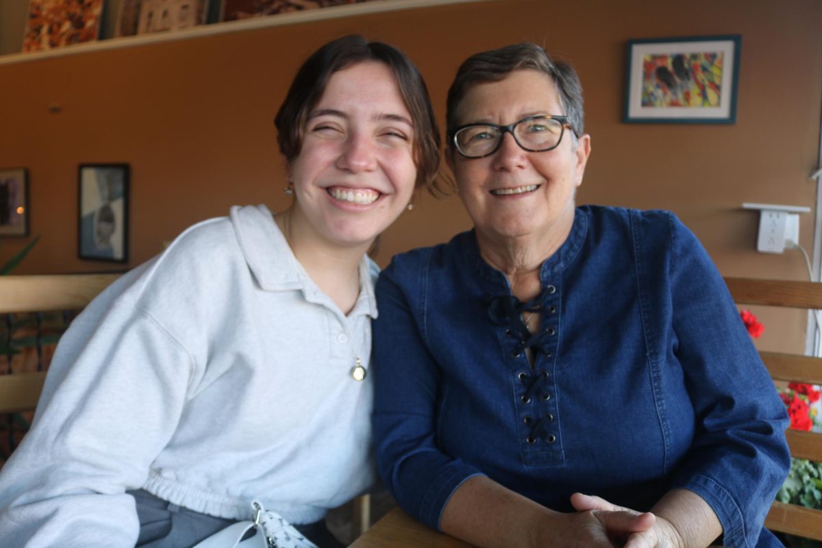 From left: S&B Reporter Thai Theodoro poses with Kim Herzberg at Saints Rest Coffee House.