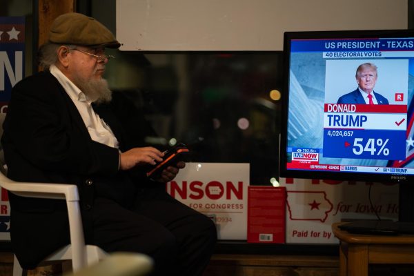 Jerome Scheuring watches election results come in at the Poweshiek County Republican Party headquarters in Grinnell, Iowa on Nov. 5, 2024.