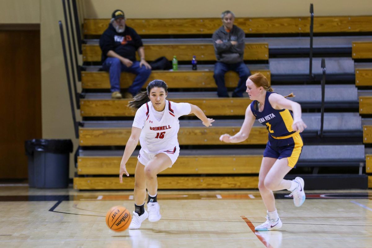 Cassidy Pak (15) dribbles the ball down the court.