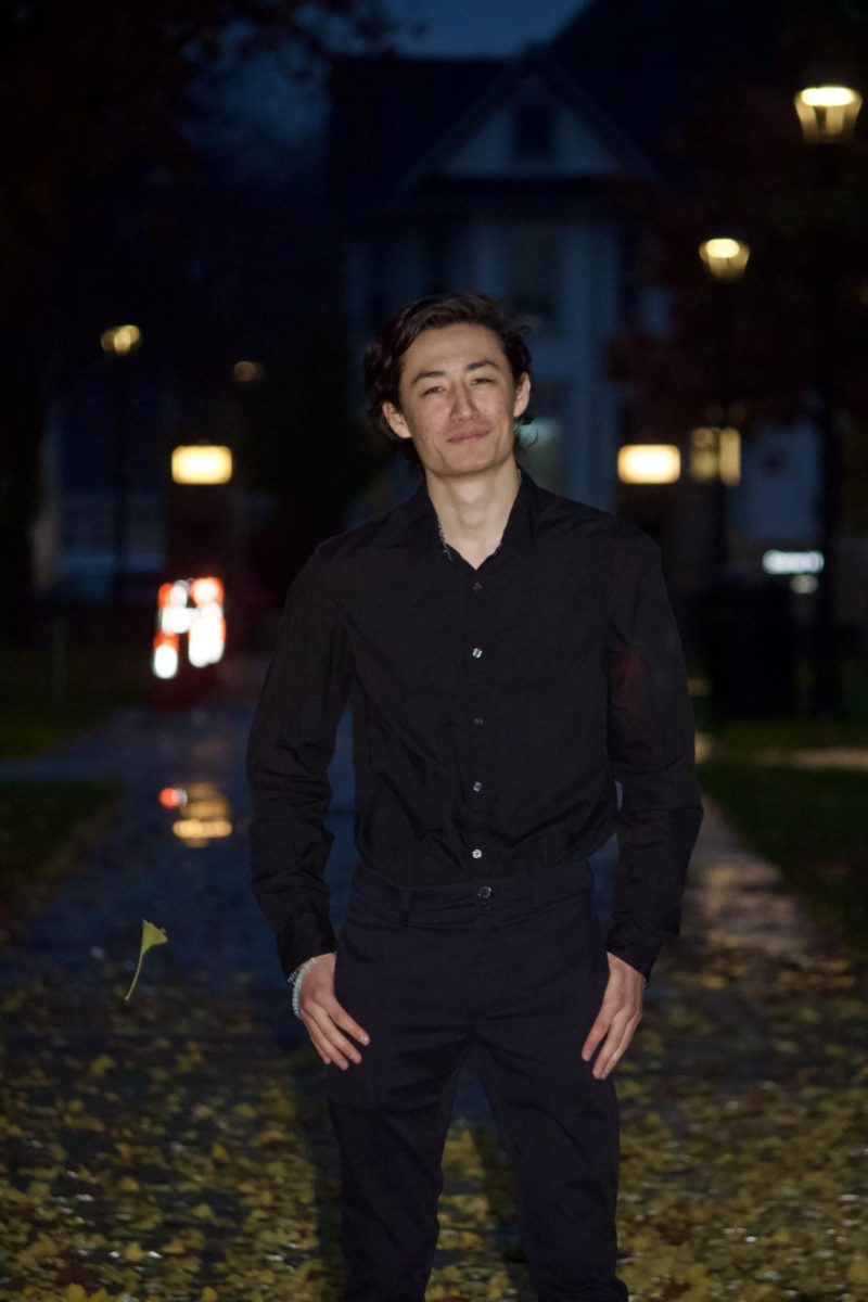 Keanu Masami Yamanaka `26 poses among the autumn leaves on campus.