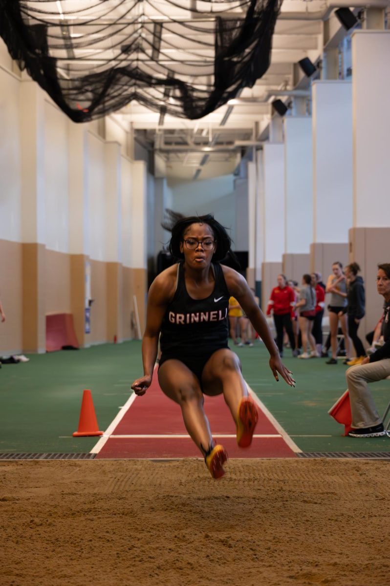 Rajanea Landers `28 mid jump during long jump event at the Darren Young Classic track meet on Feb. 14 and 15. 