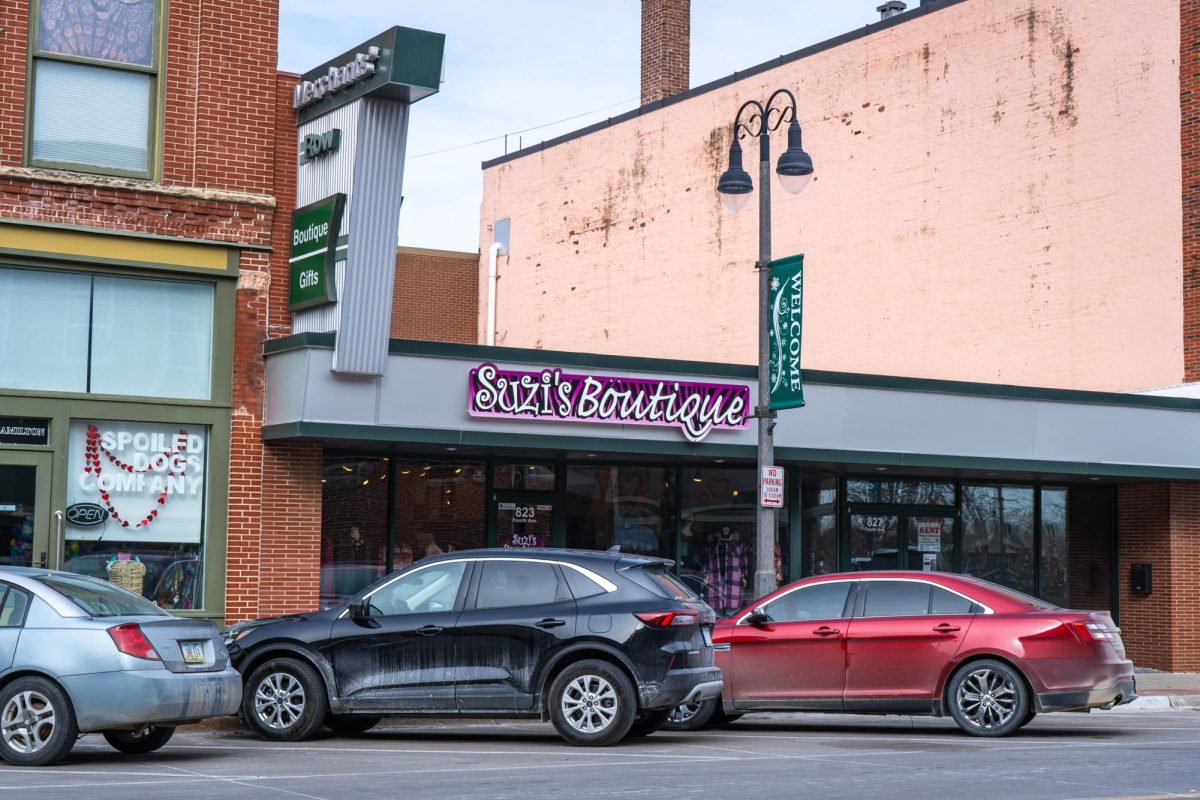 Front view of the lively local storefront, Suzi's Boutique, in downtown Grinnell.
