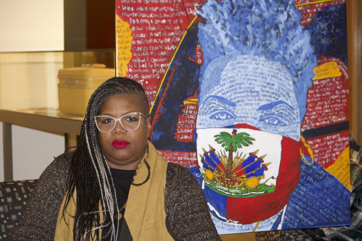 Dr. Petrouchka Moïse poses with one of her pieces on display in the Burling basement.