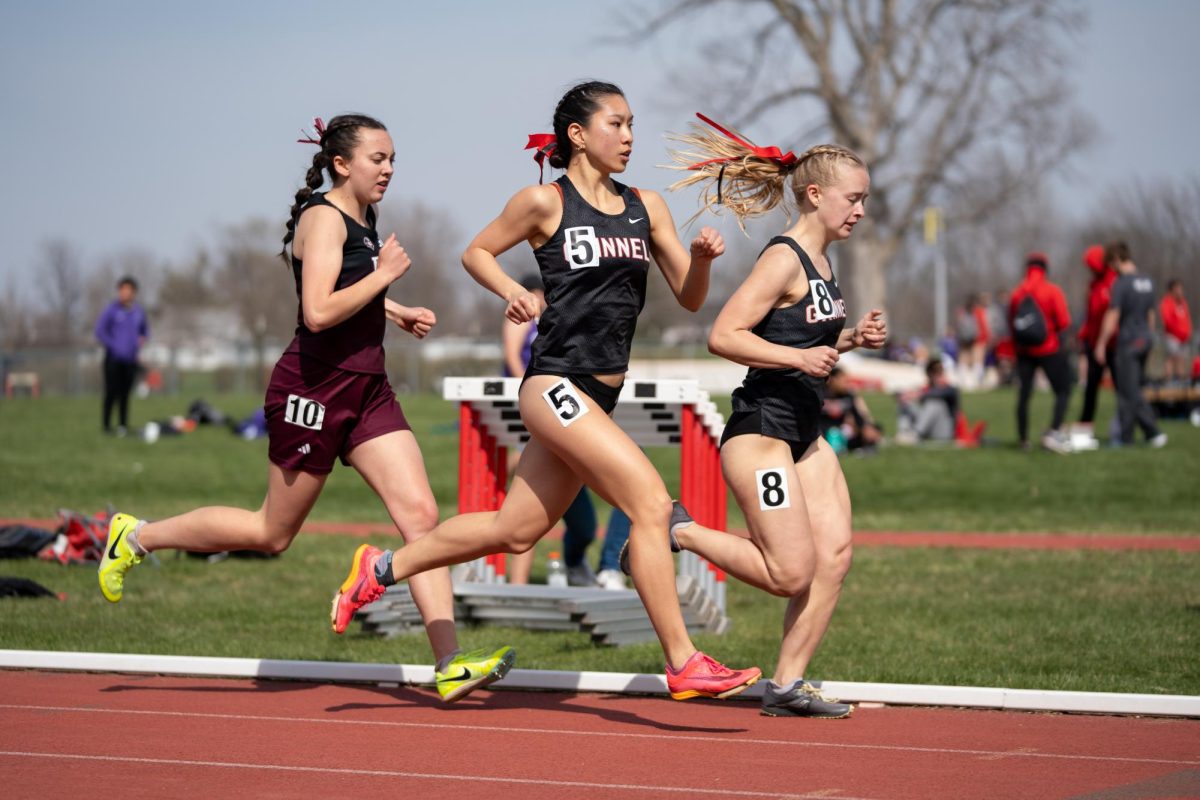 Caitlin Ong `26 runs alongside athletes on Saturday, April 12 at the Dick Young Classic Invitational. 