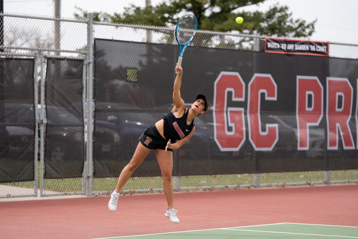 Utsah Kalra `25 hits a serve during a tennis match against UW Eau Claire on Sunday, Apr. 13. 