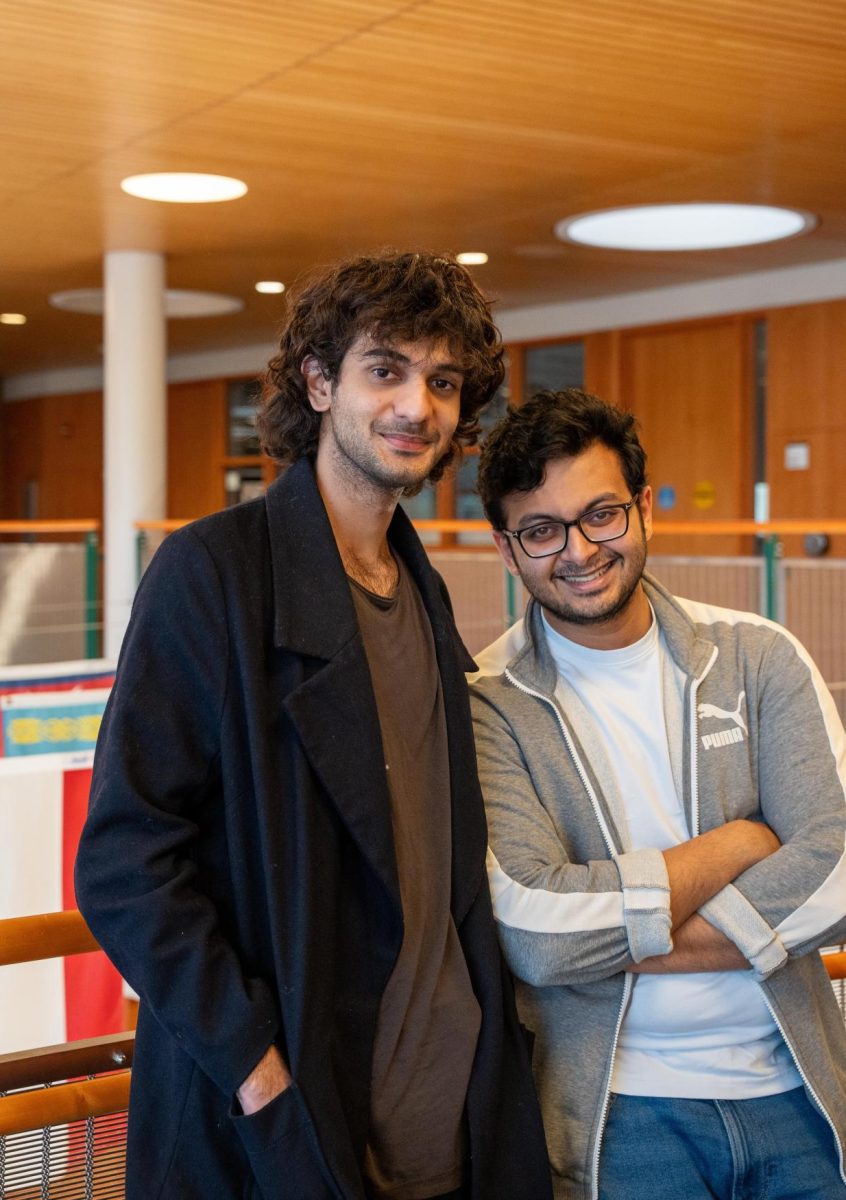 From left: Samridh Dev Singh Chib `25 and Parikshit Roychowdhury `26 pose above the Spencer Grill on April 18, 2025.