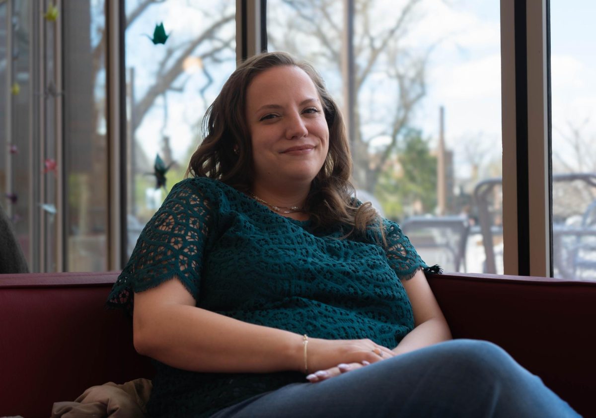 Transfer student Julie Howard `26.5 poses for a portrait in the Spencer Grill.