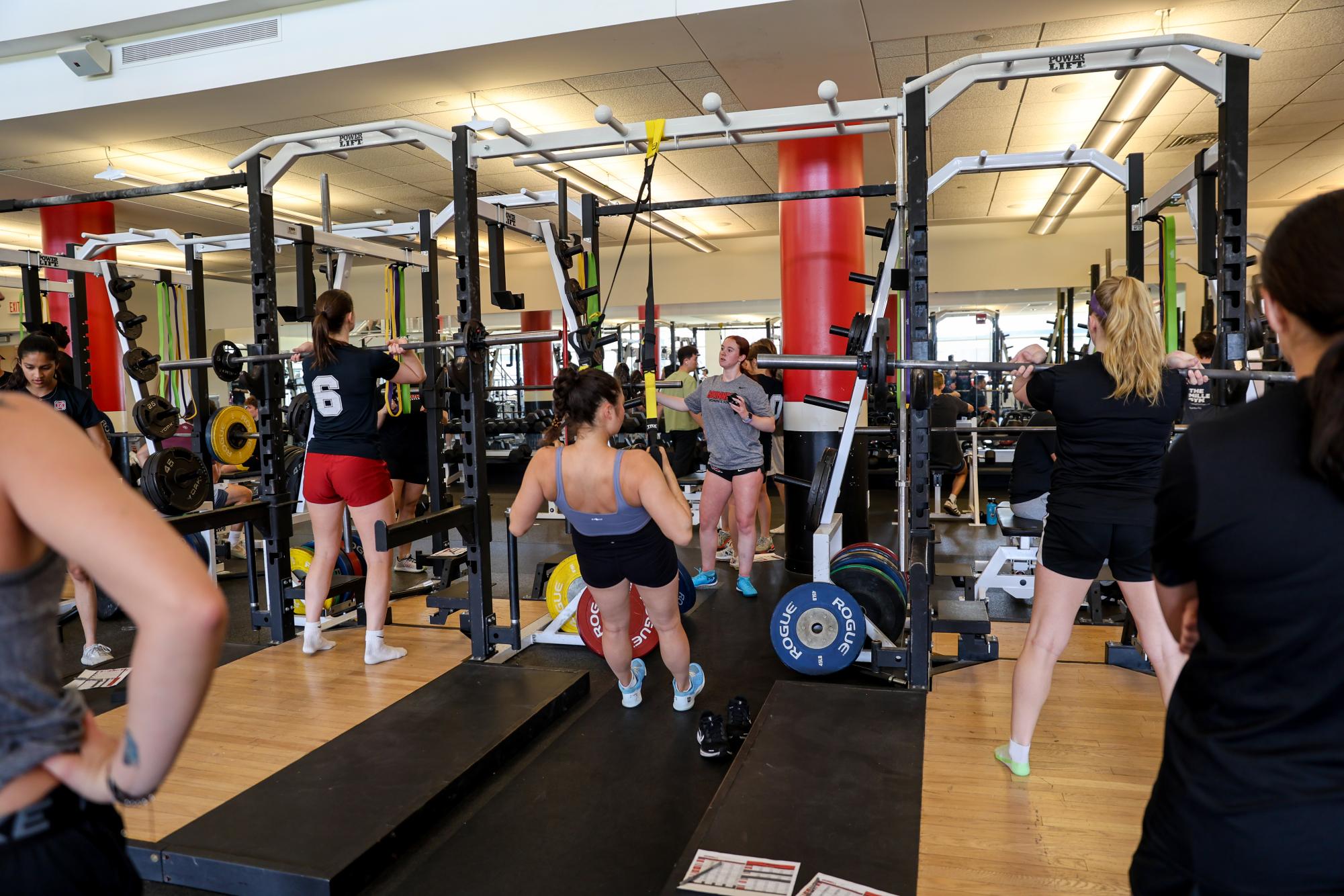 Grinnell women's soccer and tennis teams utilize the new equipment in the Fitness Center during an off-season team lift on March 31, 2025.