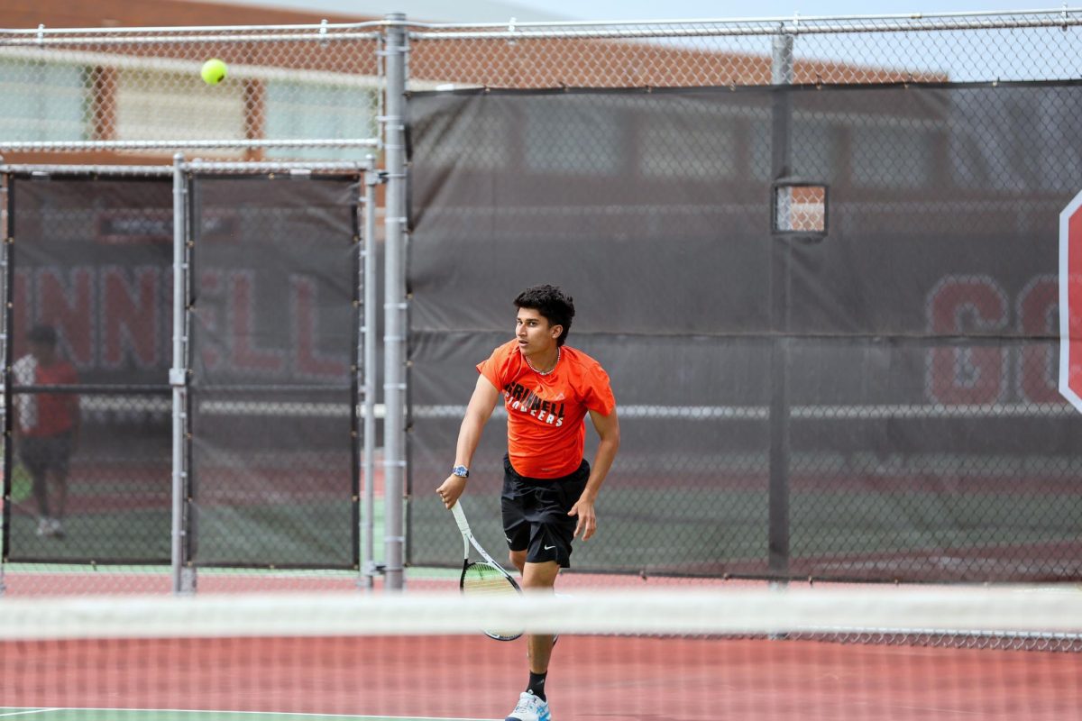 Aman Kothari '28 serves the ball during a home game against Ripon College on Saturday, Apr. 19.