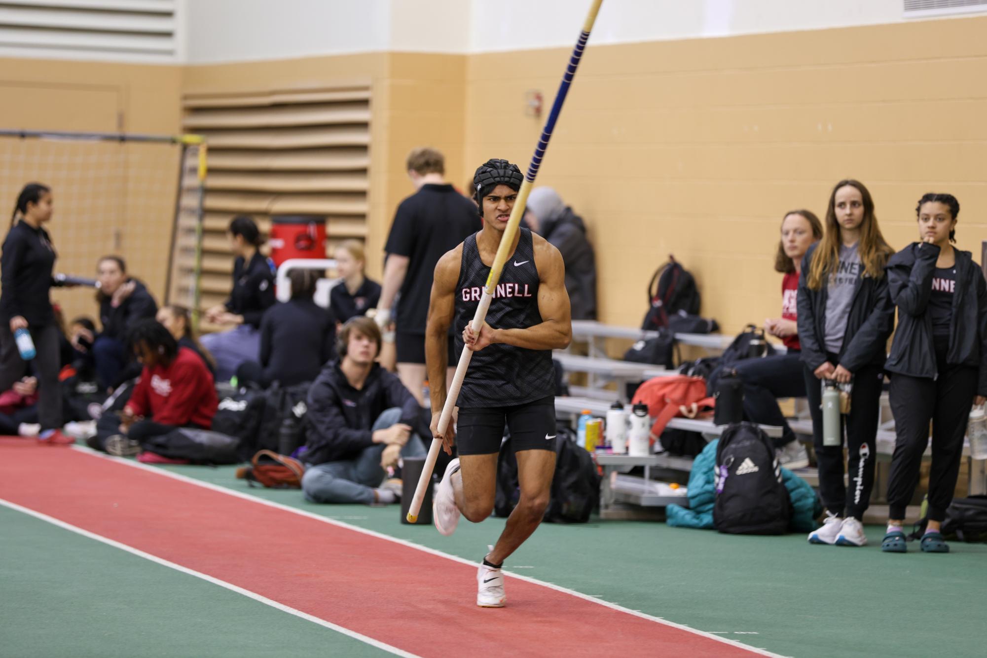 Rohan Thota `28 sprints down the pole vault runway at the Grinnell Invitational on Feb. 1, 2025 in the Field House.
