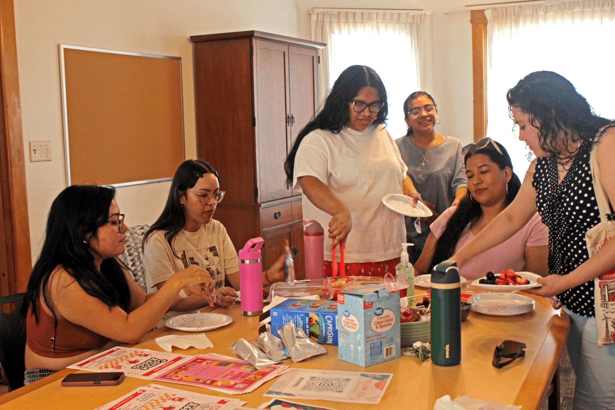 Latine students gather to eat and chat at the new Latinx/e Cultural Center (LCC) open house.