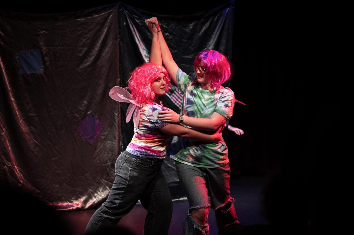 From left: Delilah Shapiro `26 and Agnes Allman `26.5 swing dance on stage.